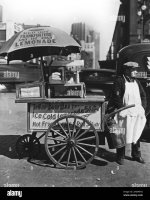 1930s-new-york-city-hot-dog-stand-west-st-and-north-moore-vendor-stands-next-to-his-tellas-bus...jpg