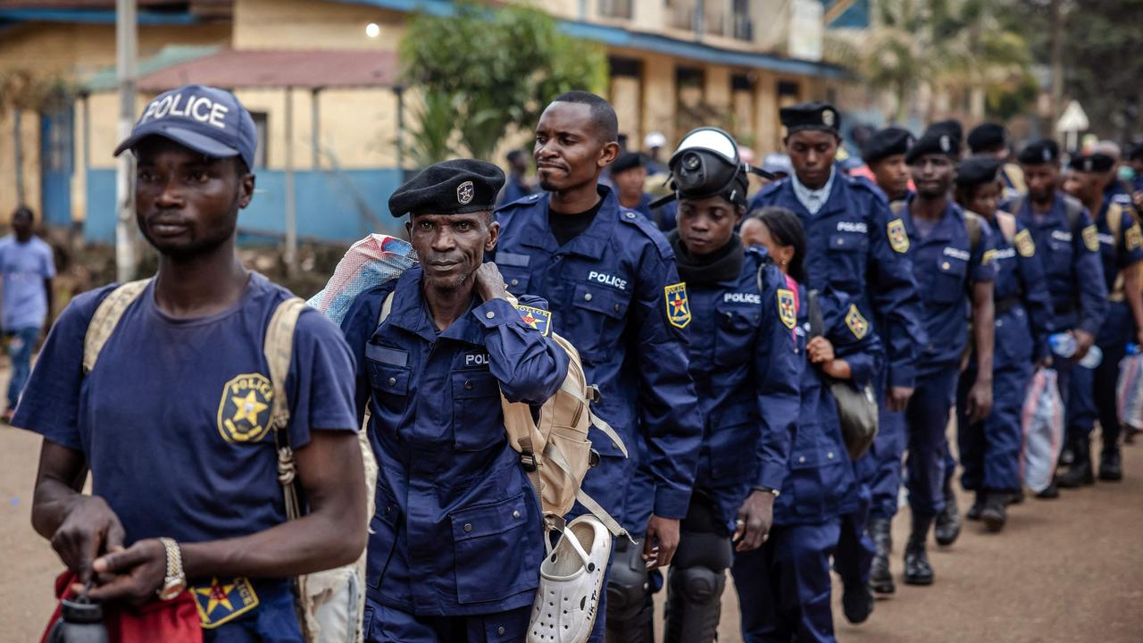 Congolese police officers line up for redeployment following an enrolment of civilians. Picture: AFP