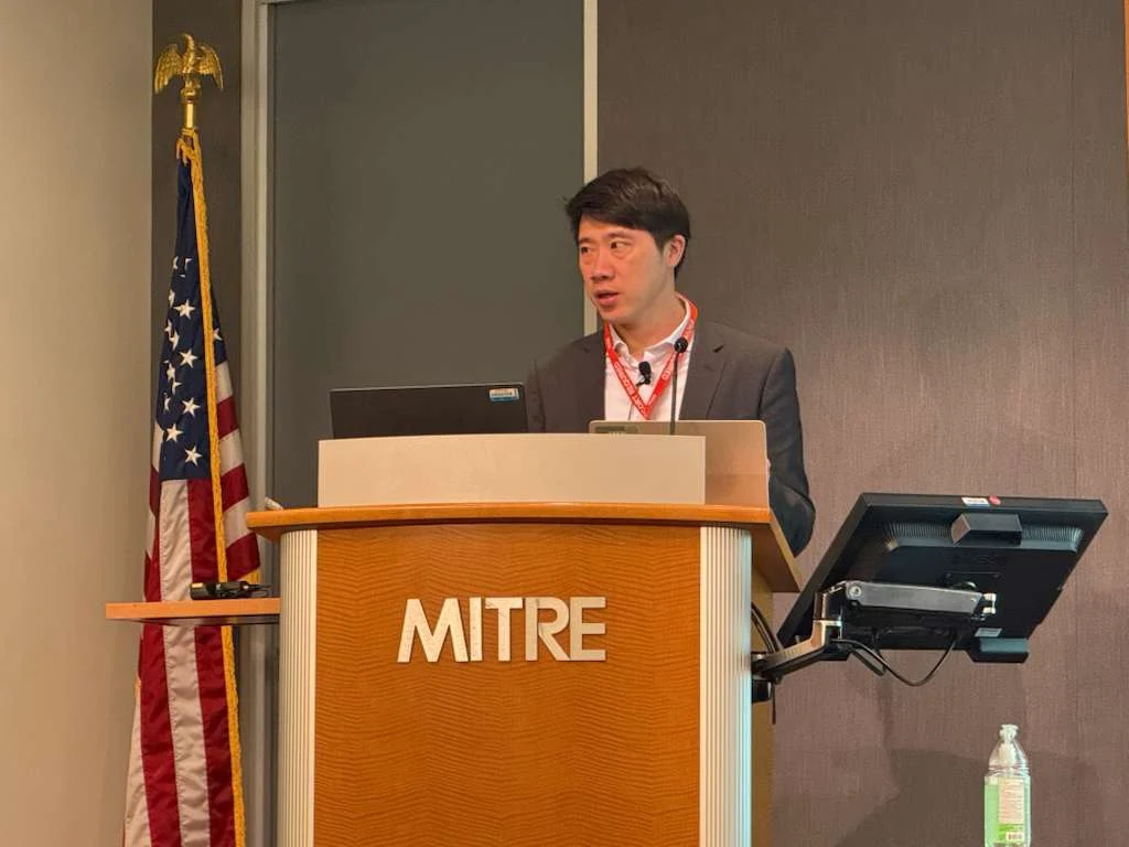 Chelpis founder and CEO Chih Ming-yang speaks at MITRE conference. (Chelpis photo)